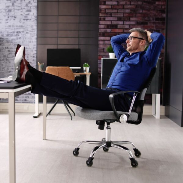 man relaxing in an office chair